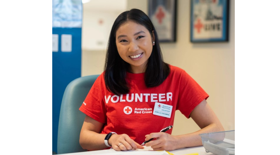 Volunteer in red shirt from the American Red Cross
