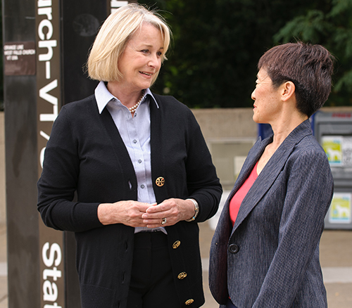 Image of Delegate Murphy talking to a constituent in front of a Metro station